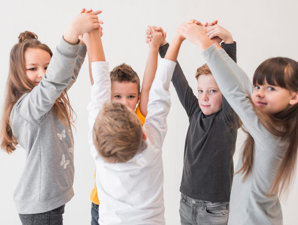children-with-their-hands-up